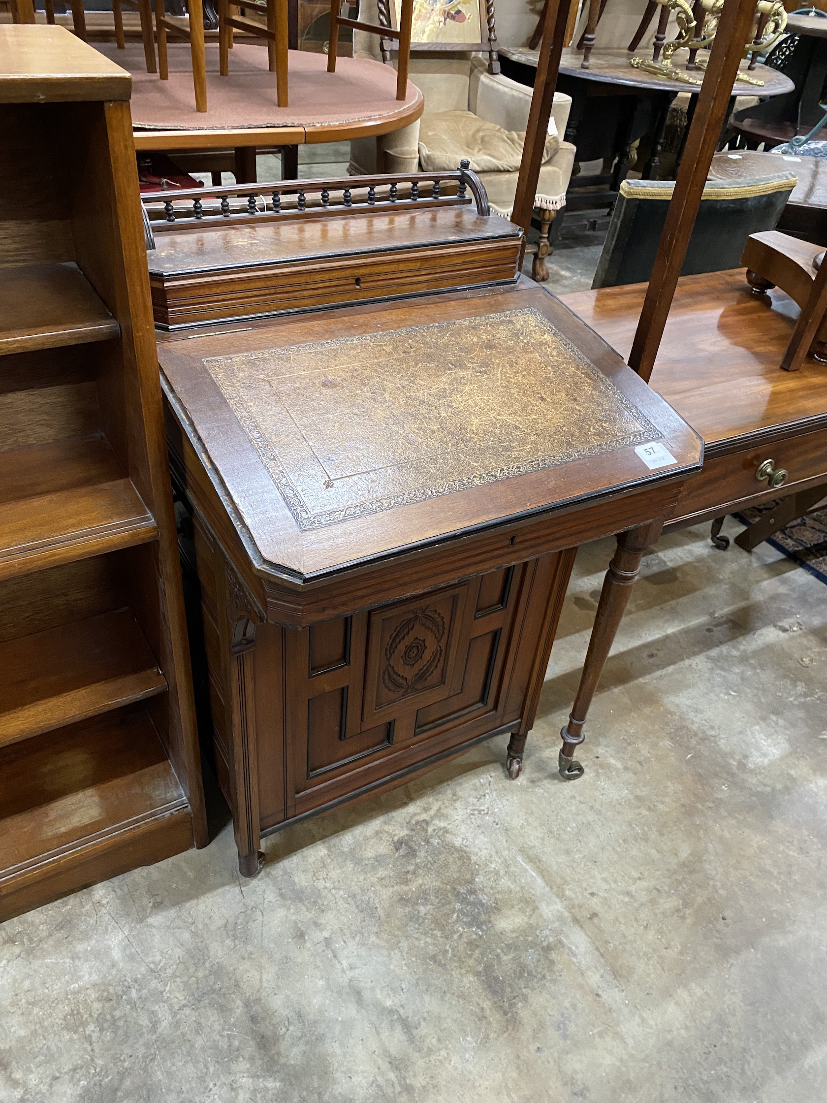 A late Victorian Aesthetic movement mahogany Davenport, width 56cm, depth 57cm, height 96cm